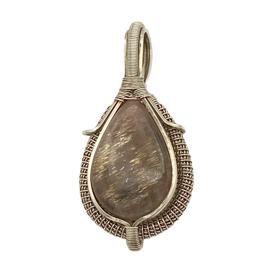 Teardrop-shaped pendant with textured silver wire wrapping on a white background